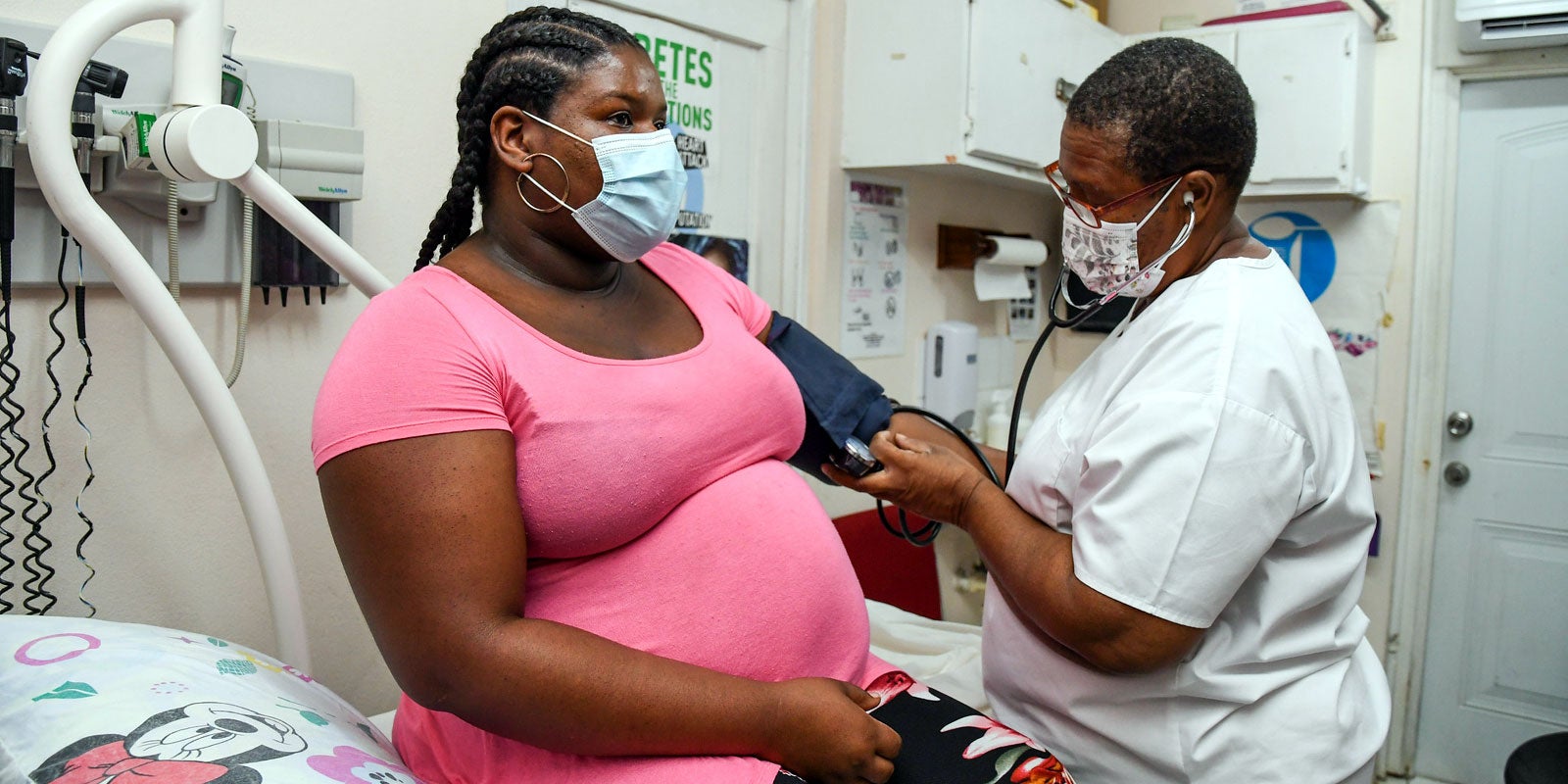 Woman being examined by nurse